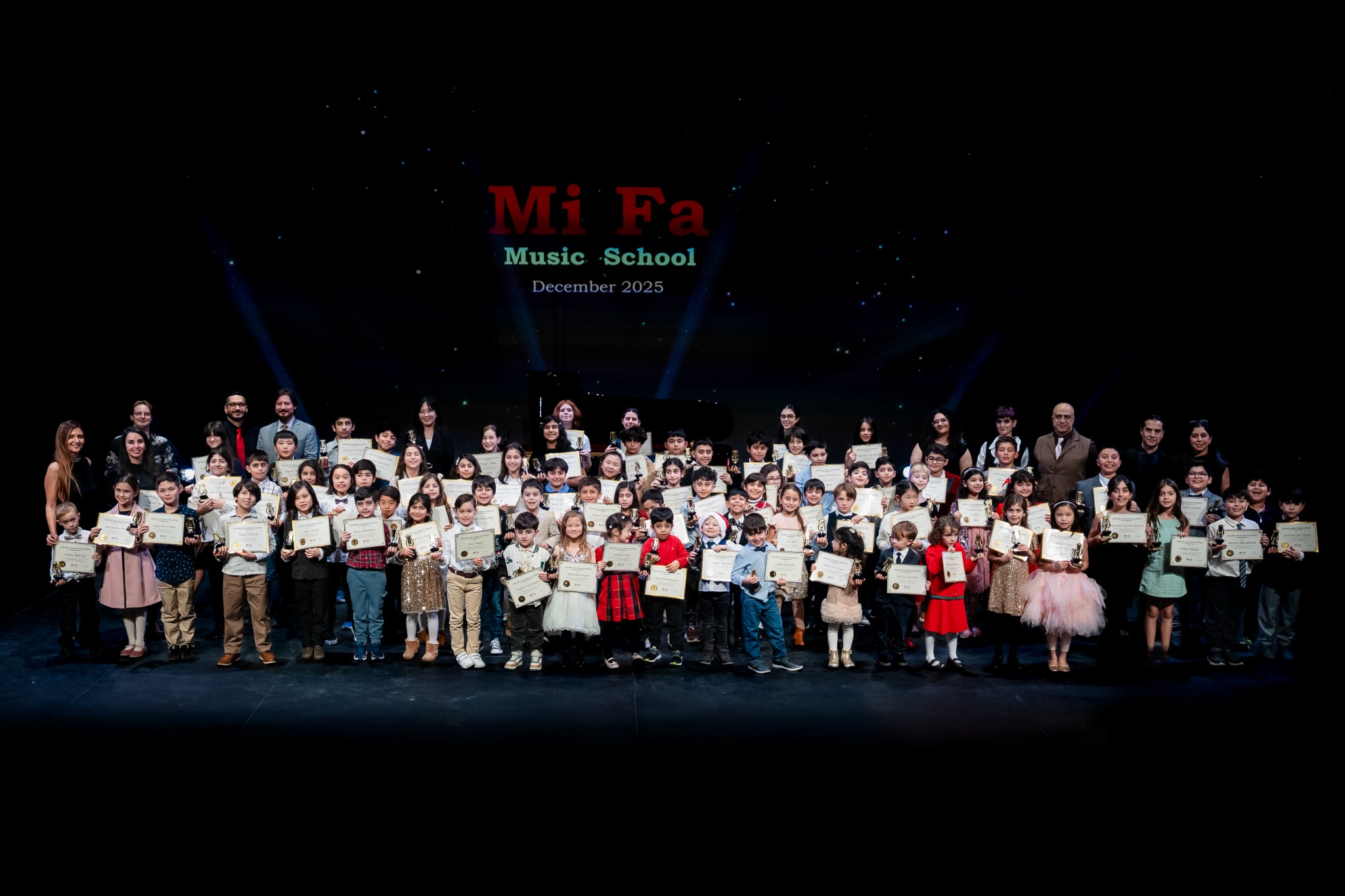 MiFa students holding certificates at the December 2025 recital